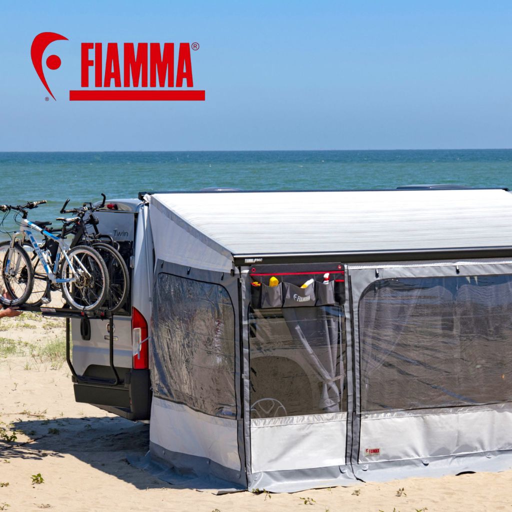 Fiamma awning and bike rack pitched up near a beach